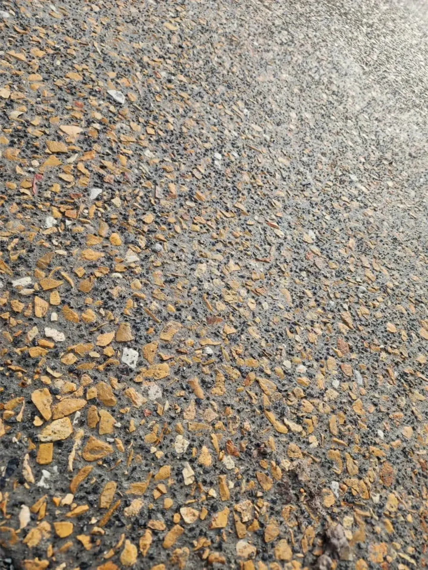 Close-up of exposed aggregate stones washed back to a crisp finish